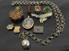 A silver pomander on chain,