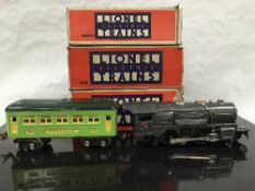 A Lionel Corporation 0-Gauge locomotive, together with four Lionel Corporation 0-Gauge carriages,