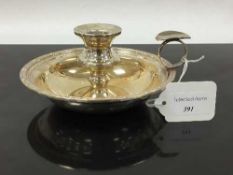 A silver Lindisfarne pattern candlestick holder with snuffer, Reid & Sons Ltd, Bimingham 1990,