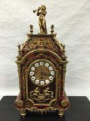 A nineteenth century style Boulle effect mantel clock, with key.