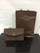 Louis Vuitton : A lady's hand bag, monogram canvas, with press-stud flaps to both sides,