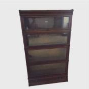 A Globe Wernicke four tier oak stacking bookcase, width 86 cm.