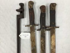 Three British 1907 India pattern bayonets, together with a socket bayonet.