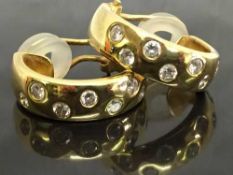 A pair of 18ct gold diamond set earrings, 12.5g.