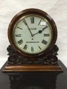 A late Victorian carved oak mantel timepiece, chain driven single fusee movement,