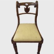 A fine set of six nineteenth century mahogany dining chairs, upholstered in golden striped material,