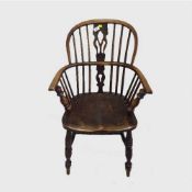 A pair of nineteenth century elm Windsor armchairs.