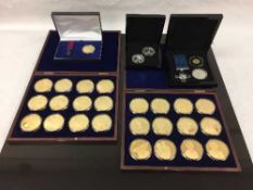 A limited edition 12 coin gold plated proof set 'Portraits of the Queen', in velvet lined case,