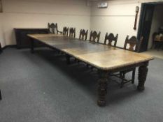 An extensive carved oak Victorian dining room suite, comprising of extending dining table,
