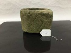 A weathered antique sandstone mortar, possibly medieval,