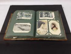 An early twentieth century postcard album containing a large quantity of postcards, rural scenes,