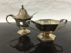 A silver salt with blue glass liner and spoon, Birmingham 1930,