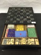 A Victorian papier mache and mother of pearl games box, circa 1880,