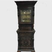 A late nineteenth century carved oak cabinet with leaded glass panel door, width 84 cm.