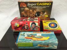 A Denys Fisher Six Billion Dollar Man figure, together with two Hydro Plane tin plate toys,
