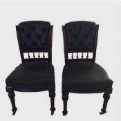 A set of six nineteenth century walnut dining chairs upholstered in studded black leather.