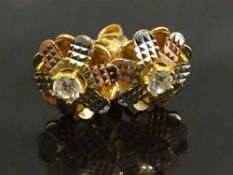 A pair of 18ct gold earrings set with diamond studs.