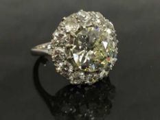 An important platinum diamond ring, the central old European cut stone approximately 3.