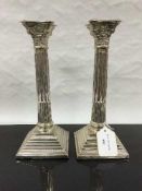 A pair of silver Corinthian column candlesticks, Alexander Smith, Birmingham 1955, weighing 1135g,