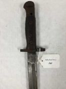 A British 1907 Enfield sword bayonet, in leather scabbard.