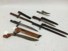 A Canadian Ross Rifle bayonet, a Finnish model 1942 bayonet, two other knife bayonets,