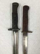 A German Third Reich Mauser bayonet, together with a German trench dagger.