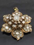 A Victorian rose-cut diamond pendant, the petals encrusted with diamonds and backed in gold,