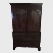 An early nineteenth century mahogany press on bracket feet, width 124 cm.