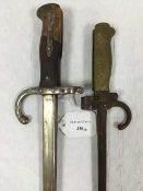 A French Gras bayonet, 52cm tapering blade and steel scabbard, together with a French Lebel bayonet.