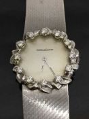 An 18ct white gold Jaeger-le-Coultre Lady's watch, the dial set with diamonds, 59.2g.