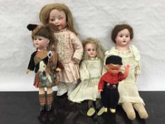 An Armand Marseille bisque doll modelled as a Scottish child wearing a kilt,