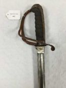 An 1821 pattern artillery sword, 81cm single fullered blade etched with martial decoration,