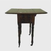 A Victorian mahogany work table with flap sides on reeded legs, width 47.5 cm.