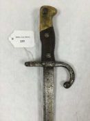 A French Gras bayonet, 52cm tapering blade and steel scabbard.