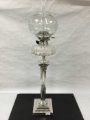 An impressive silver plated Corinthian style crystal and etched glass oil lamp, height 89cm.