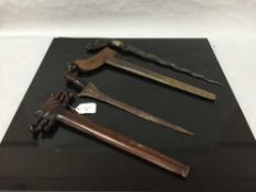 A Malayan kris dagger, with wavy watered steel blade and carved hardwood grip,