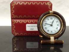 A Cartier of Paris travelling alarm clock, numbered 7522 10561, in original case.