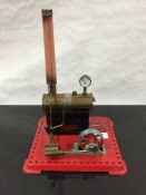 A Mamod stationary steam live engine, on tin base.