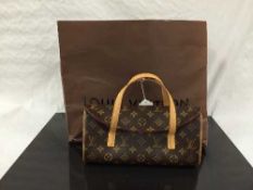 Louis Vuitton : A lady's hand bag, monogram canvas, with tan trim, with press-stud single flap top,