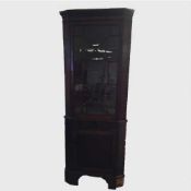 A nineteenth century mahogany glazed corner cabinet, height 208.5 cm.