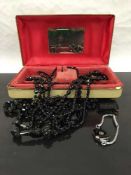 A collection of antique and later Whitby jet jewellery comprising of seven necklaces,