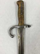 A French Chassepot Yataghan sword bayonet, 57cm recurving blade, black painted steel scabbard.