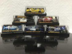 A large quantity of Scalextric equipment including eleven boxed cars, five unboxed cars,