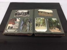 An early twentieth century postcard album containing a large quantity of postcards, rural scenes,