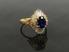 An 18ct gold sapphire and diamond cluster ring, size L.