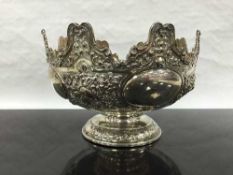 An embossed silver fruitbowl or monteith, Holland Aldwinkle & Slater, London 1895, diameter 23cm,