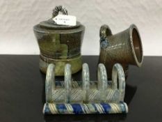 Jane Hamlyn (born 1940): A salt glaze biscuit jar and lid, in blue/green glaze, of waisted form,