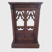 A late nineteenth century Gothic carved pitch pine lectern, width 77 cm.