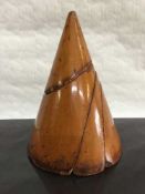 A nineteenth century fruitwood teaching aid in four piece cone form, height 17 cm.