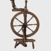 A late nineteenth century beechwood spinning wheel, height 101 cm.